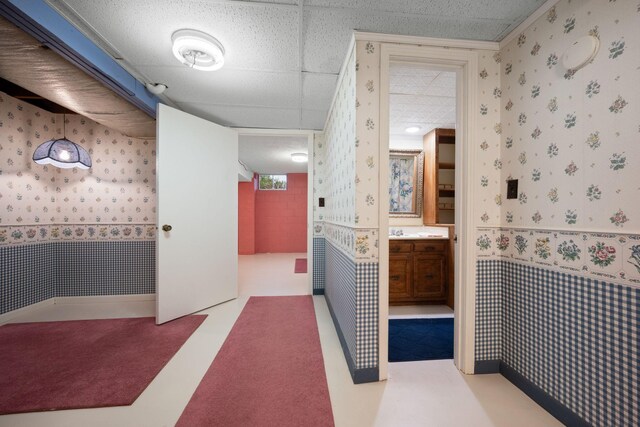 915 Taylor Cir, Burns, TN 37029 - bathroom featuring wallpapered walls, vanity, and wainscoting