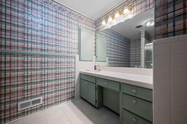 915 Taylor Cir, Burns, TN 37029 - full bath with tile patterned flooring, vanity, wallpapered walls, and a textured ceiling