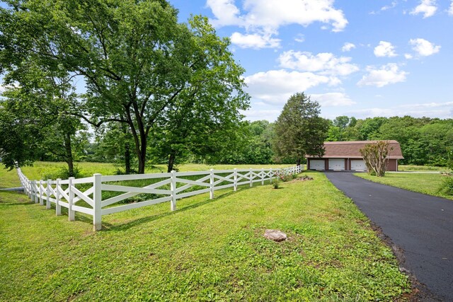 915 Taylor Cir, Burns, TN 37029 - view of yard with a detached garage