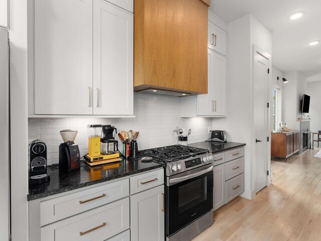 1319 Monetta Ave, Nashville, TN 37216 - kitchen with stainless steel gas range, light wood finished floors, dark stone countertops, decorative backsplash, and recessed lighting
