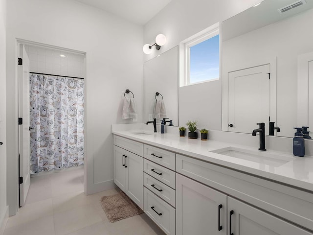 1319 Monetta Ave, Nashville, TN 37216 - full bathroom featuring double vanity, tile patterned flooring, and curtained shower