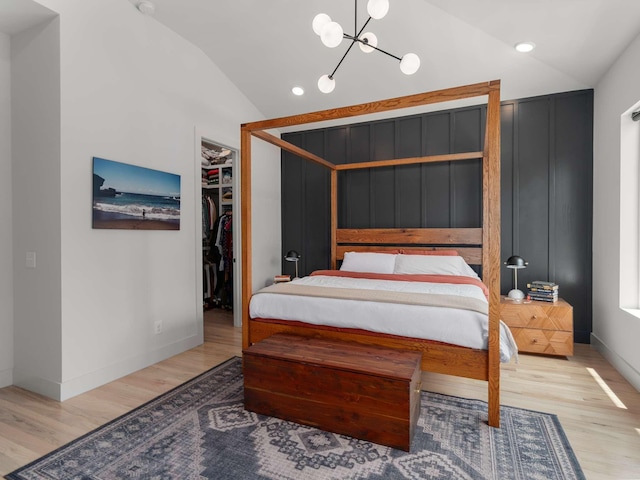 1319 Monetta Ave, Nashville, TN 37216 - bedroom featuring lofted ceiling, wood finished floors, a spacious closet, a chandelier, and recessed lighting