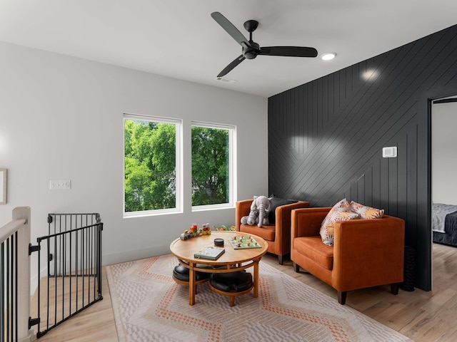 1319 Monetta Ave, Nashville, TN 37216 - living area featuring light wood-style flooring, a ceiling fan, baseboards, and an upstairs landing