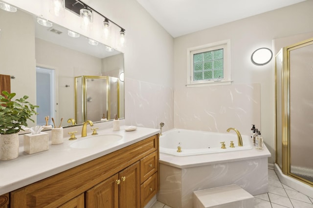 full bath with a shower stall, vanity, a garden tub, and tile patterned floors