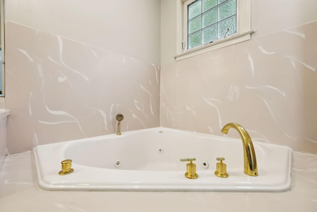 bathroom featuring a whirlpool tub