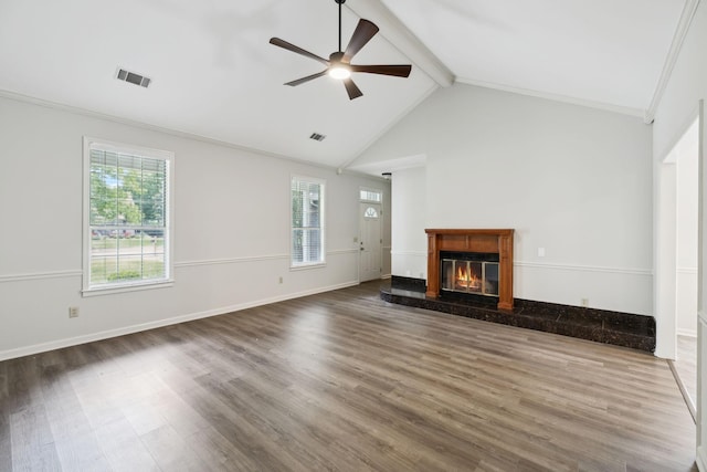 unfurnished living room featuring beam ceiling, wood finished floors, a high end fireplace, a ceiling fan, and high vaulted ceiling