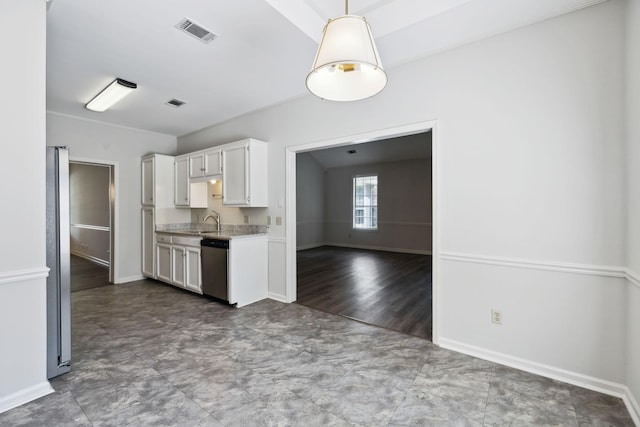 kitchen with stainless steel appliances, white cabinets, a sink, baseboards, and hanging light fixtures