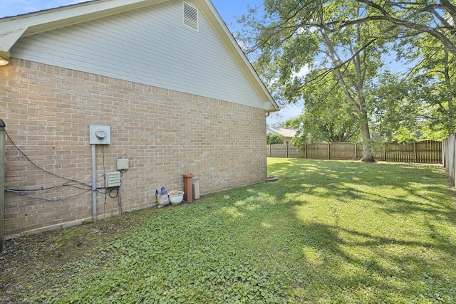view of side of home featuring brick siding