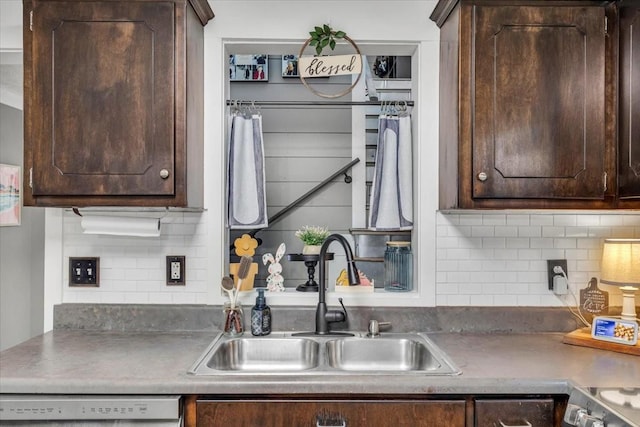 kitchen with a sink, dark brown cabinetry, backsplash, and dishwasher