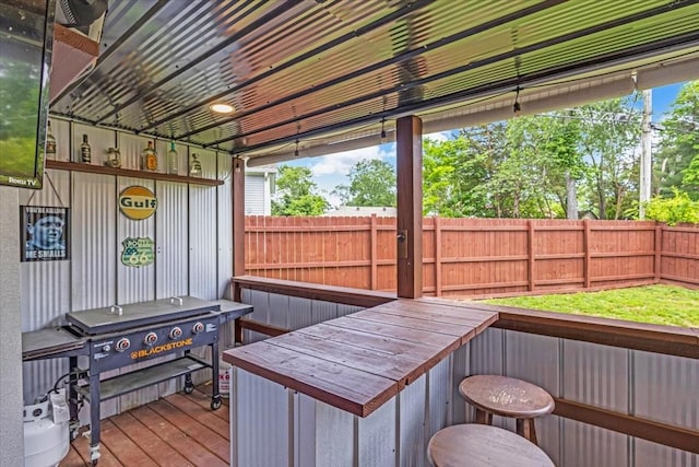 wooden deck with fence and a grill