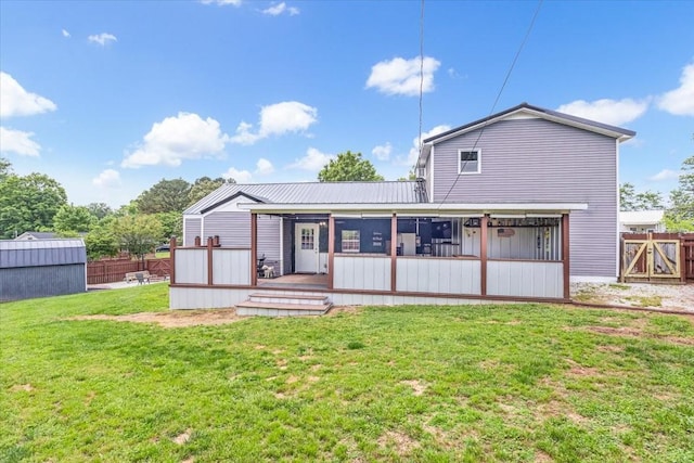 back of property featuring metal roof