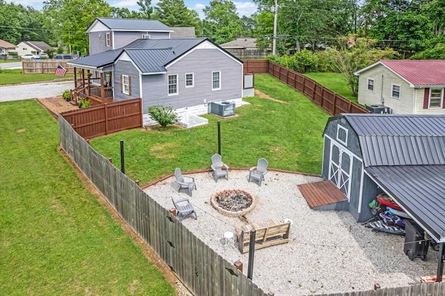 view of yard with a fire pit