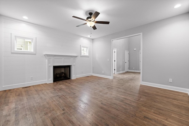 1860 Oakvale Dr, Chattanooga, TN 37421 - unfurnished living room with ceiling fan, wood finished floors, a fireplace, baseboards, and recessed lighting