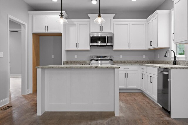 1860 Oakvale Dr, Chattanooga, TN 37421 - kitchen featuring appliances with stainless steel finishes, recessed lighting, white cabinets, and wood finished floors