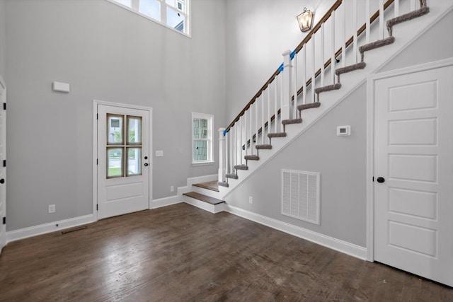 1860 Oakvale Dr, Chattanooga, TN 37421 - entrance foyer featuring healthy amount of natural light, stairs, wood finished floors, a towering ceiling, and baseboards