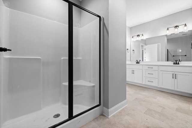 1860 Oakvale Dr, Chattanooga, TN 37421 - bathroom featuring a stall shower, double vanity, baseboards, and tile patterned floors