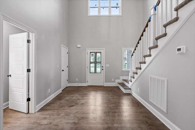 1860 Oakvale Dr, Chattanooga, TN 37421 - foyer featuring stairway, a towering ceiling, wood finished floors, and baseboards