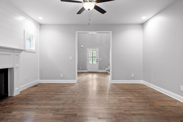 1860 Oakvale Dr, Chattanooga, TN 37421 - unfurnished living room featuring a ceiling fan, dark wood-style flooring, a fireplace, baseboards, and recessed lighting