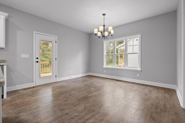 1860 Oakvale Dr, Chattanooga, TN 37421 - unfurnished dining area with healthy amount of natural light, a chandelier, and dark wood-type flooring