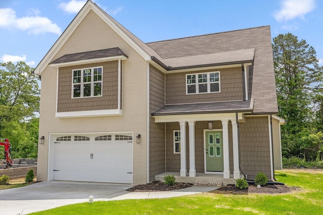 1860 Oakvale Dr, Chattanooga, TN 37421 - view of front of property featuring a garage, covered porch, concrete driveway, and a shingled roof
