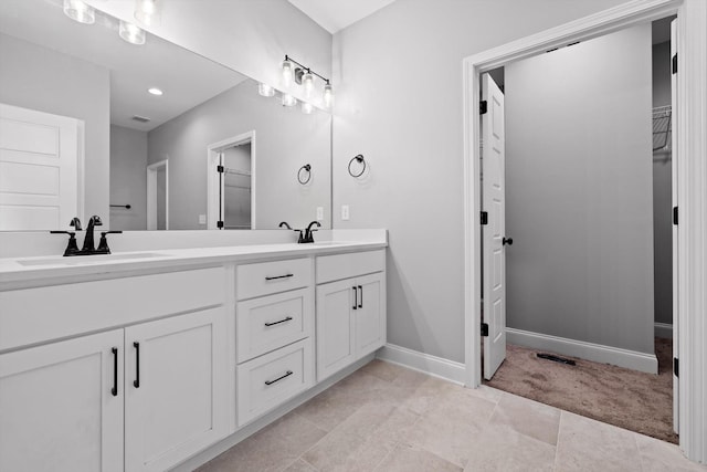 1860 Oakvale Dr, Chattanooga, TN 37421 - full bath featuring double vanity, a spacious closet, and baseboards