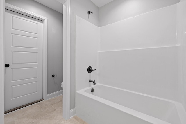 1860 Oakvale Dr, Chattanooga, TN 37421 - full bath with toilet, shower / bath combination, baseboards, and tile patterned flooring