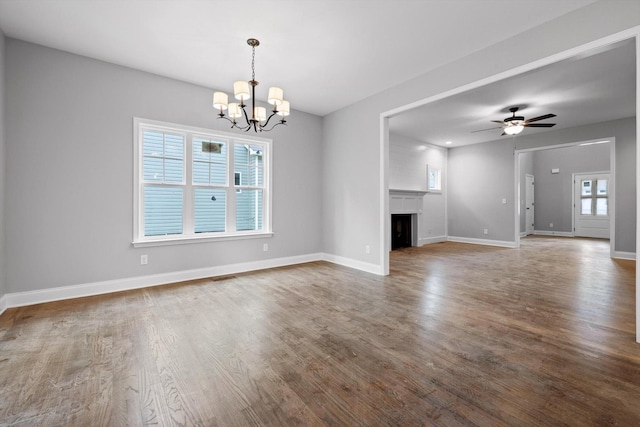 1860 Oakvale Dr, Chattanooga, TN 37421 - unfurnished living room with a chandelier, wood finished floors, baseboards, and a fireplace