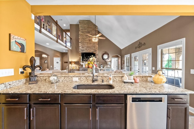 3015 Prince Dr, Clarksville, TN 37043 - kitchen featuring dishwasher, arched walkways, a sink, high vaulted ceiling, and open floor plan