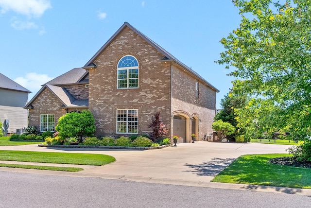 3015 Prince Dr, Clarksville, TN 37043 - view of front of house featuring brick siding, concrete driveway, and a garage