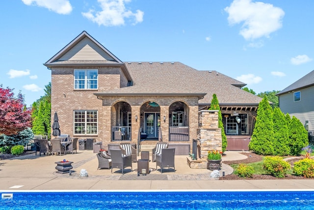 3015 Prince Dr, Clarksville, TN 37043 - rear view of house with a patio area, a shingled roof, brick siding, and an outdoor pool