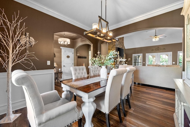 3015 Prince Dr, Clarksville, TN 37043 - dining area with arched walkways, dark wood finished floors, crown molding, and a ceiling fan