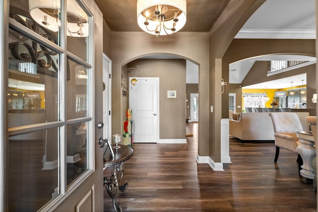 3015 Prince Dr, Clarksville, TN 37043 - foyer with arched walkways, dark wood-type flooring, a chandelier, ornamental molding, and baseboards