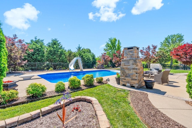 3015 Prince Dr, Clarksville, TN 37043 - view of swimming pool featuring a water slide, a patio, a fenced backyard, and a diving board