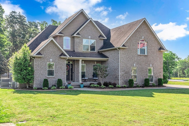 1002 Loblolly Dr, Murfreesboro, TN 37128 - craftsman-style house featuring a front lawn, a porch, a shingled roof, and brick siding