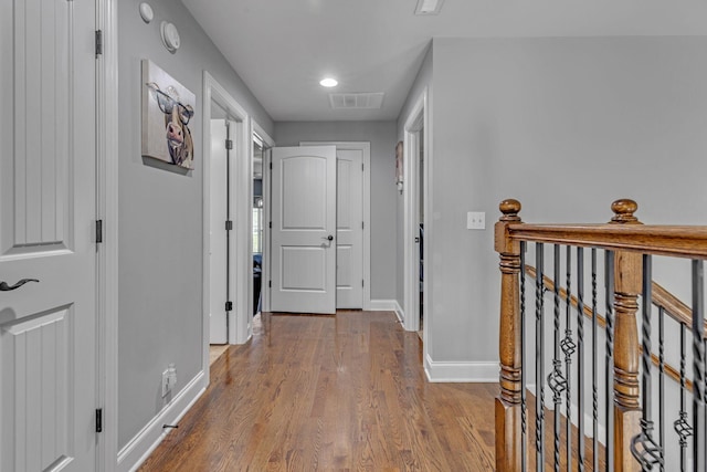 1002 Loblolly Dr, Murfreesboro, TN 37128 - hallway with an upstairs landing, baseboards, wood finished floors, and recessed lighting