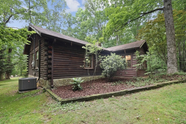 7261 Kingston Rd, Fairview, TN 37062 - view of side of property featuring central air condition unit, log siding, and a lawn