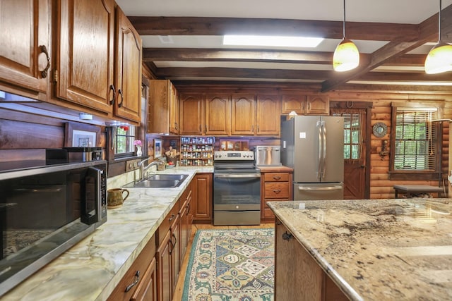 7261 Kingston Rd, Fairview, TN 37062 - kitchen with stainless steel appliances, a sink, beamed ceiling, brown cabinets, and light stone counters
