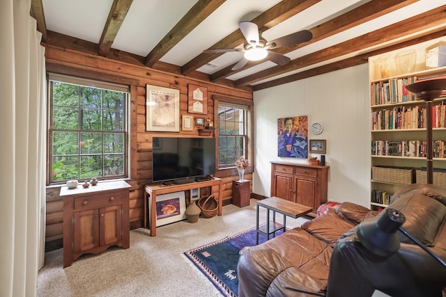 7261 Kingston Rd, Fairview, TN 37062 - living room with plenty of natural light, beam ceiling, ceiling fan, light colored carpet, and wooden walls
