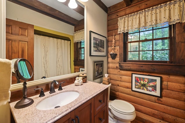 7261 Kingston Rd, Fairview, TN 37062 - full bathroom featuring log walls, vanity, toilet, and curtained shower