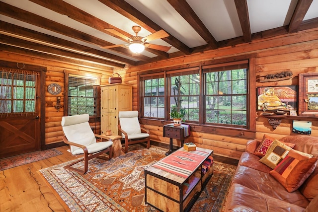 7261 Kingston Rd, Fairview, TN 37062 - living area with beamed ceiling, wood-type flooring, and a ceiling fan