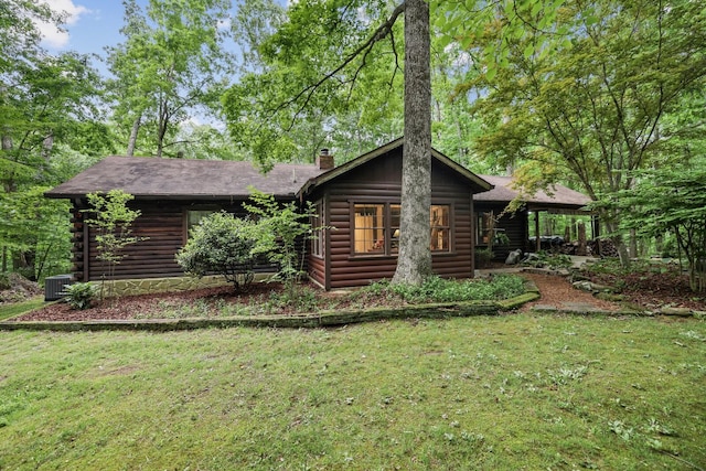 7261 Kingston Rd, Fairview, TN 37062 - log home with a chimney, a front yard, central air condition unit, and log siding