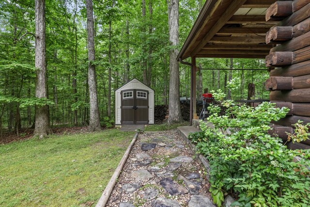 7261 Kingston Rd, Fairview, TN 37062 - view of grassy yard featuring a shed and an outbuilding