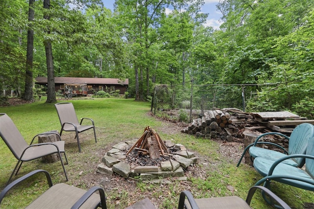 7261 Kingston Rd, Fairview, TN 37062 - view of grassy yard featuring a fire pit and a forest view