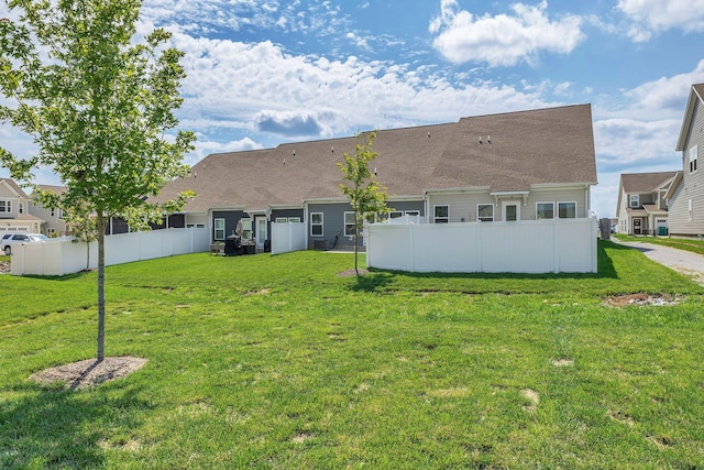 rear view of property featuring roof with shingles