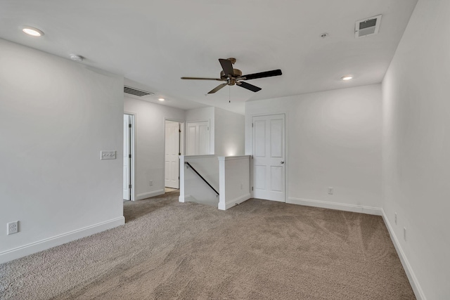 carpeted empty room with baseboards, recessed lighting, ceiling fan, and a smoke detector