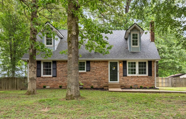 new england style home with crawl space, entry steps, a chimney, and brick siding
