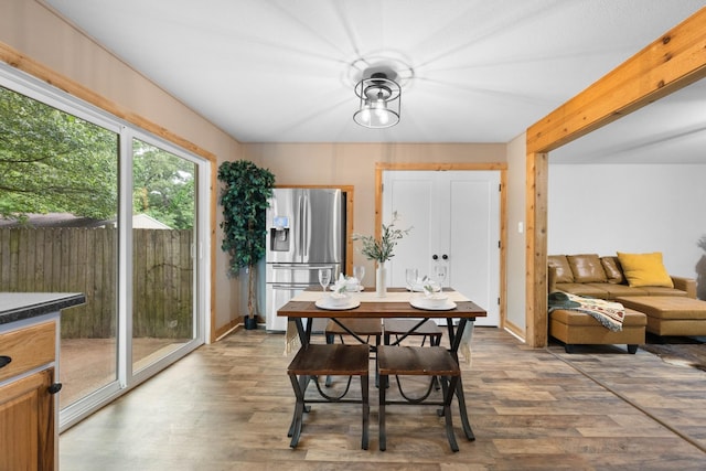 dining space with wood finished floors