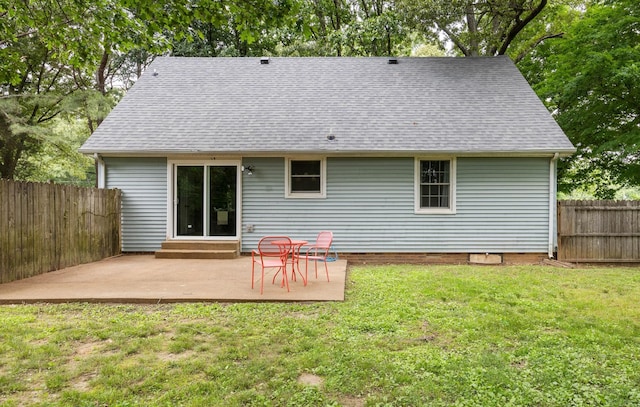 rear view of property with a patio, a shingled roof, and entry steps