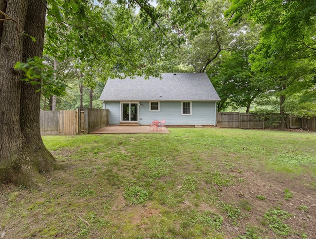 back of house featuring a deck, crawl space, and a shingled roof