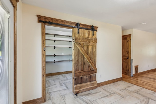 46 Seay Ln, Erin, TN 37061 - interior space featuring baseboards and a barn door